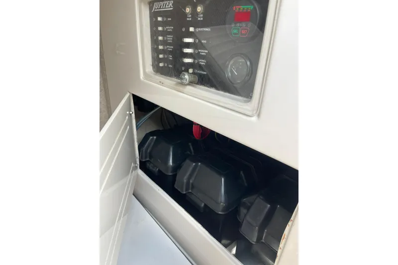 Slide: The Image of Open storage compartment on a 2003 Jupiter 27 boat deck. - 39