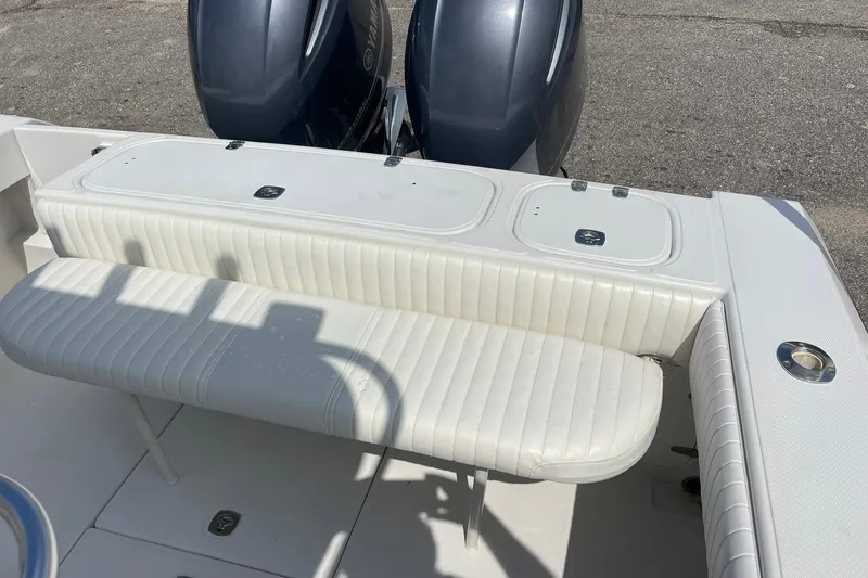 Slide: The Image of Interior of a 2003 Jupiter 27 boat showing steering wheel and rod holders. - 41