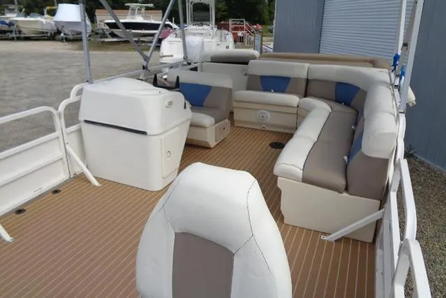 Slide: The Image of 2008 Bentley Pontoons 200 CRUISE interior with spacious seating and helm, docked outdoors. - 17