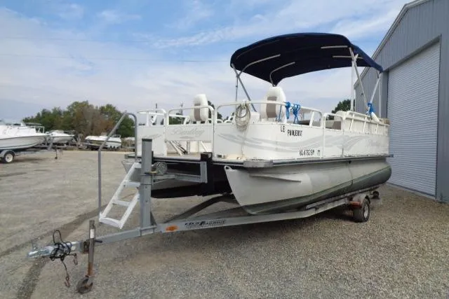 Slide: The Image of 2008 Bentley Pontoons 200 CRUISE on trailer, parked outdoors near a storage facility. - 3