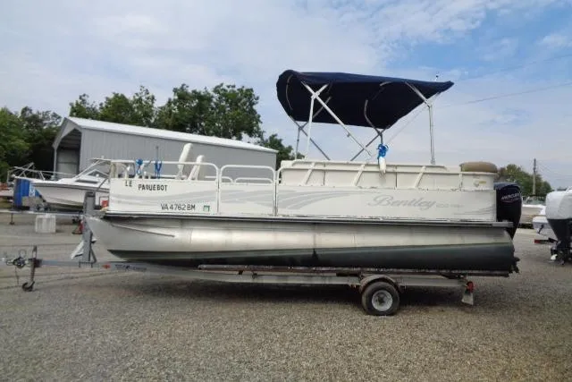Slide: The Image of 2008 Bentley Pontoons 200 CRUISE on trailer with canopy, parked outdoors. - 4