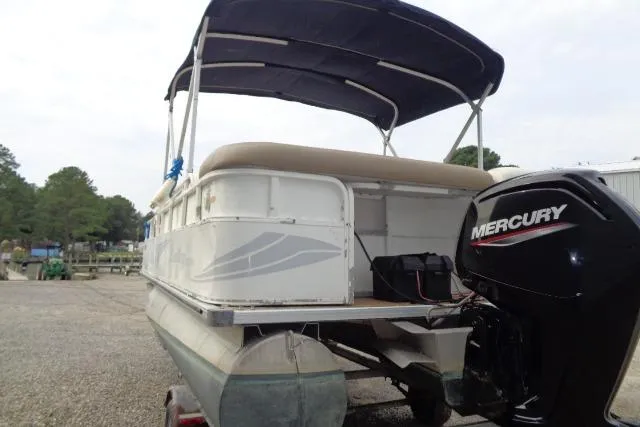 Slide: The Image of 2008 Bentley Pontoons 200 CRUISE with Mercury outboard engine, parked on a trailer. - 5