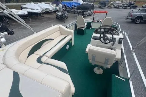 Slide: The Image of 2005 Tahoe Fish-N-Fun 22 pontoon boat with spacious seating and green carpet. - 11