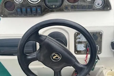 Slide: The Image of Steering wheel and dashboard of 2005 Tahoe Fish-N-Fun 22 boat. - 13