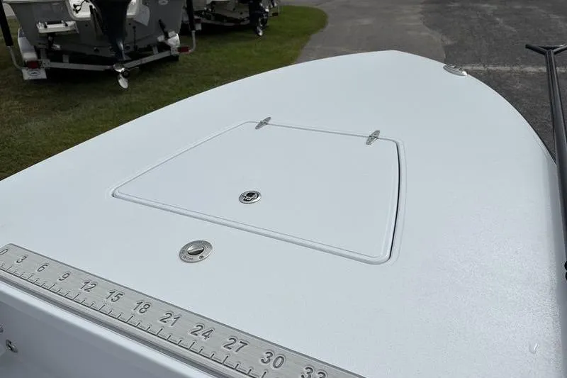 Slide: The Image of 2025 East Cape EVO boat deck with hatch and measurement scale. - 12