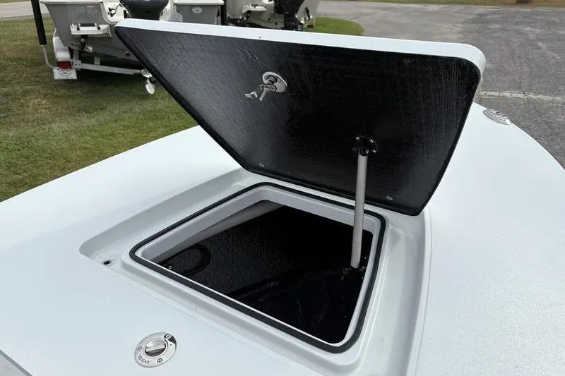 Slide: The Image of Open storage compartment on 2025 East Cape EVO boat, showcasing interior space. - 13