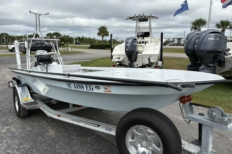 Slide: The Image of 2025 East Cape EVO boat on trailer, parked outdoors with overcast sky. - 5