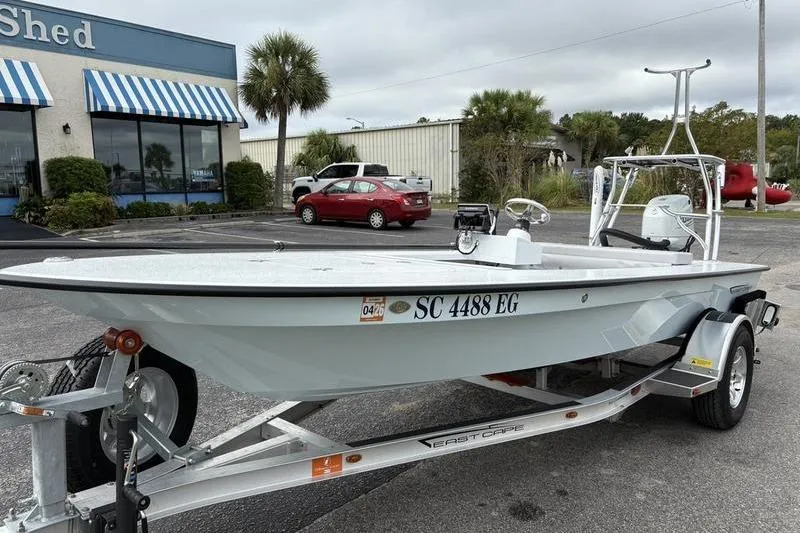 Slide: The Image of 2025 East Cape EVO boat on trailer in parking lot. - 7