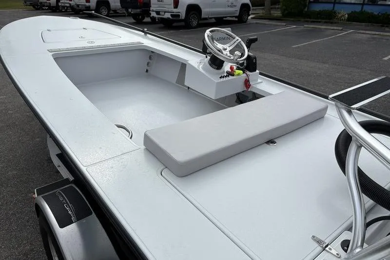 Slide: The Image of 2025 East Cape EVO boat with sleek design, featuring a Garmin navigation system. - 9