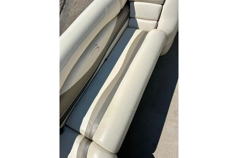 Slide: The Image of 2006 Bennington 2250 RL boat seating with beige and gray upholstery. - 14