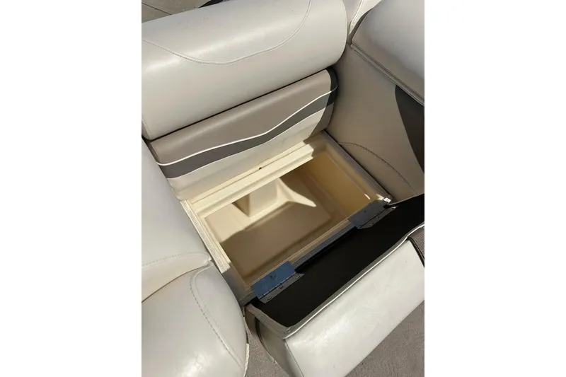 Slide: The Image of Open storage compartment in 2006 Bennington 2250 RL boat seat. - 22