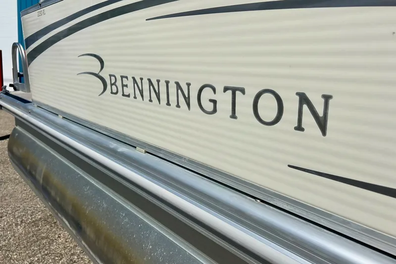 Slide: The Image of 2006 Bennington 2250 RL pontoon boat side view with logo. - 3