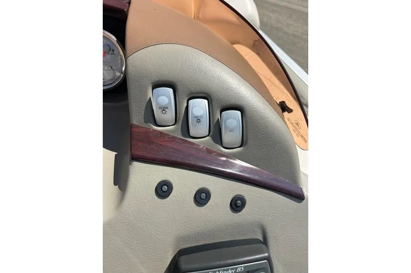 Slide: The Image of Dashboard of a 2006 Bennington 2250 RL boat with control switches. - 34