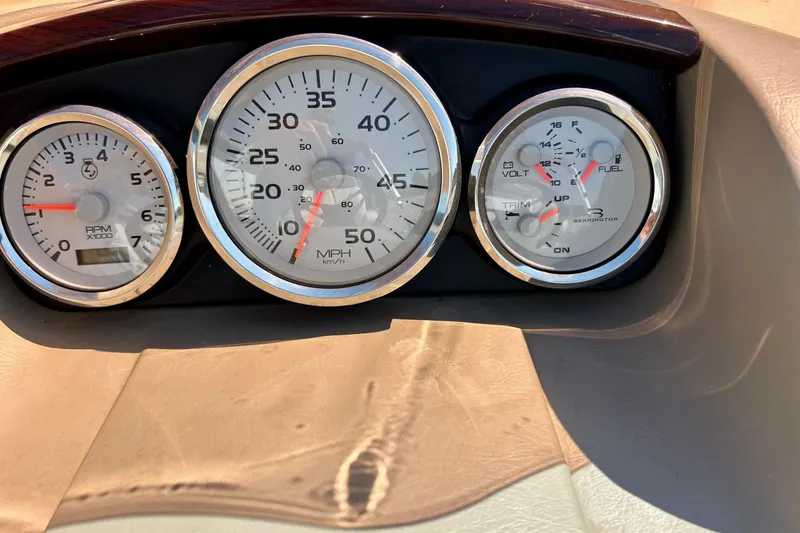 Slide: The Image of Dashboard gauges of a 2006 Bennington 2250 RL boat, showing RPM, speed, and fuel levels. - 35
