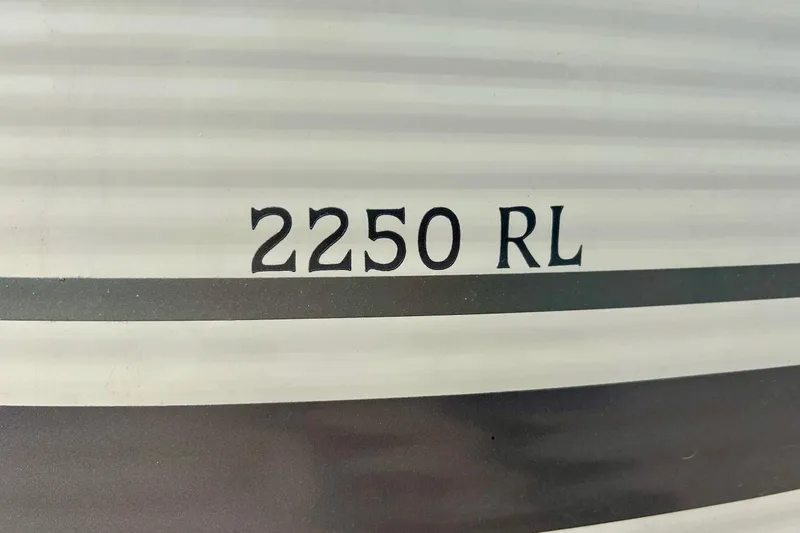 Slide: The Image of Close-up of 2006 Bennington 2250 RL model lettering on boat exterior. - 4