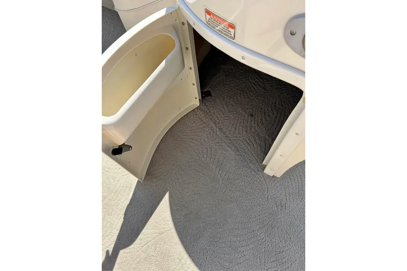 Slide: The Image of Open storage compartment on 2006 Bennington 2250 RL boat, showing interior details. - 40