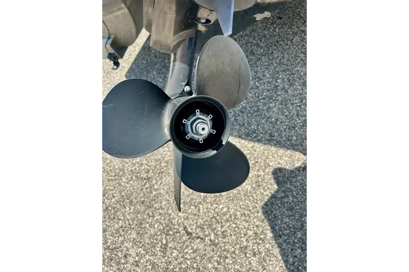 Slide: The Image of Close-up of a 2006 Bennington 2250 RL boat propeller on asphalt. - 45