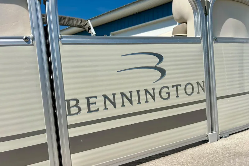 Slide: The Image of 2006 Bennington 2250 RL pontoon boat side view with logo and metallic finish. - 5