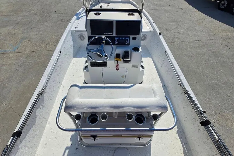 Slide: The Image of 2014 Blazer Bay 2170 boat interior with steering console and seating. - 10