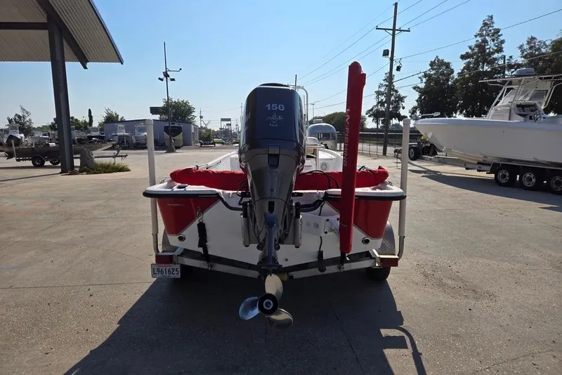Slide: The Image of 2014 Blazer Bay 2170 boat with 150 HP engine, parked outdoors. - 4