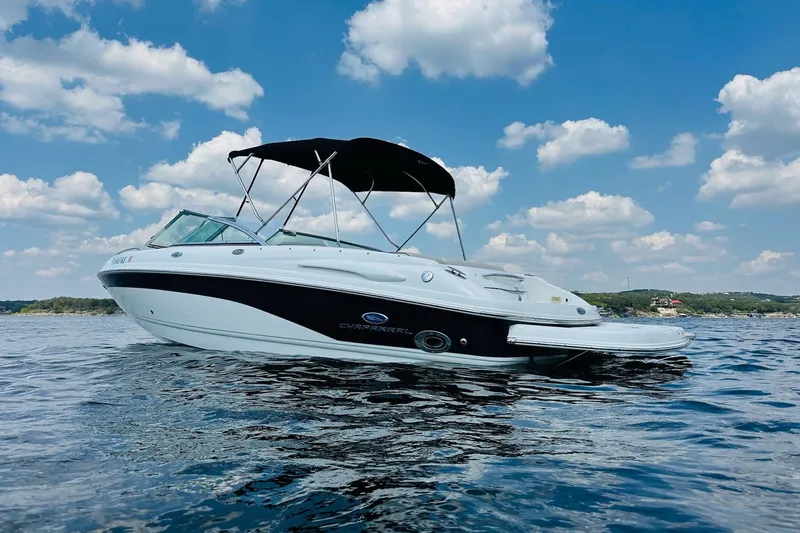 Slide: The Image of 2005 Chaparral 220 SSi boat on water under blue sky with clouds. - 5