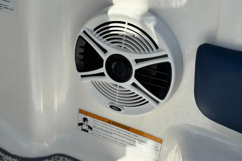 Slide: The Image of Speaker on 2014 Chaparral 21 H2O Sport boat interior, with warning label visible. - 27