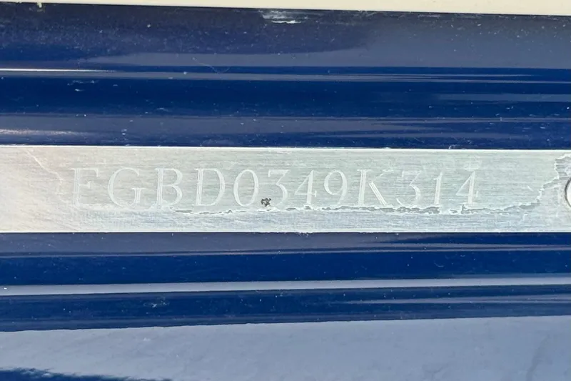 Slide: The Image of 2014 Chaparral 21 H2O Sport boat identification number on blue hull. - 31