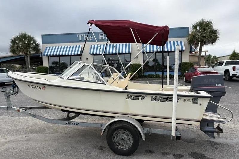 Slide: The Image of 1996 Key West 1720 Dual Console boat with Yamaha motor on trailer. - 0