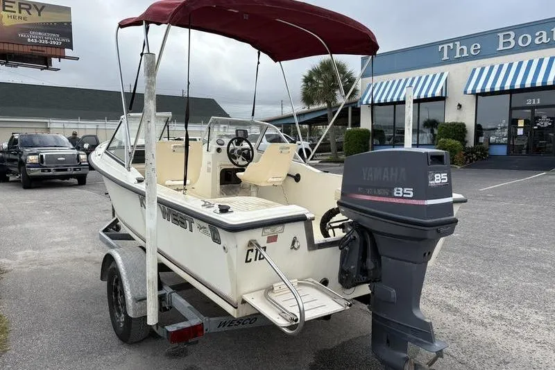 Slide: The Image of 1996 Key West 1720 Dual Console boat with Yamaha 85 outboard motor on trailer. - 1