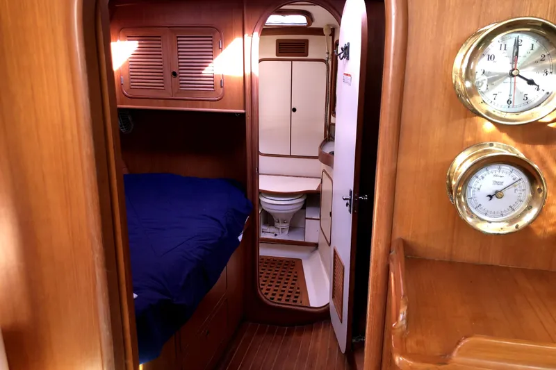 Slide: The Image of Interior of 1989 Taswell 43 yacht with cozy cabin and nautical instruments. - 29