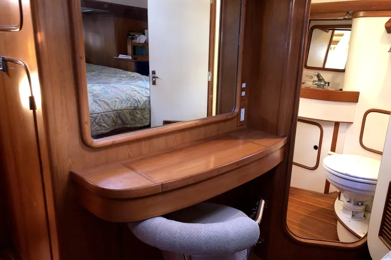 Slide: The Image of Interior of 1989 Taswell 43 yacht with wooden vanity and bathroom. - 35