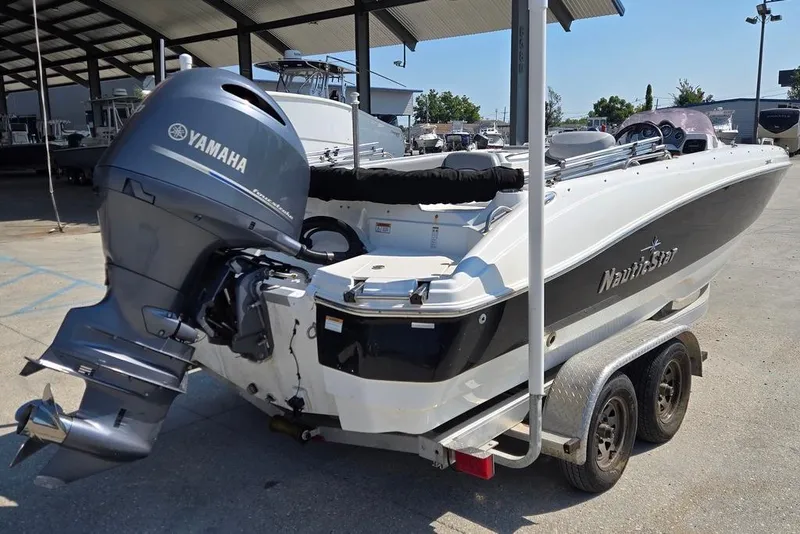 Slide: The Image of 2021 NauticStar 203 SE boat on trailer with Yamaha outboard motor. - 3