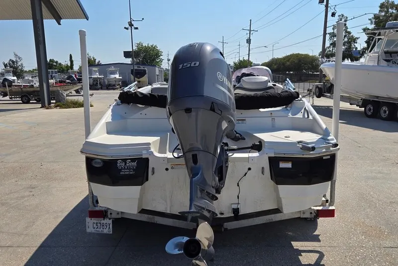 Slide: The Image of 2021 NauticStar 203 SE boat with Yamaha 150 outboard motor on trailer. - 4