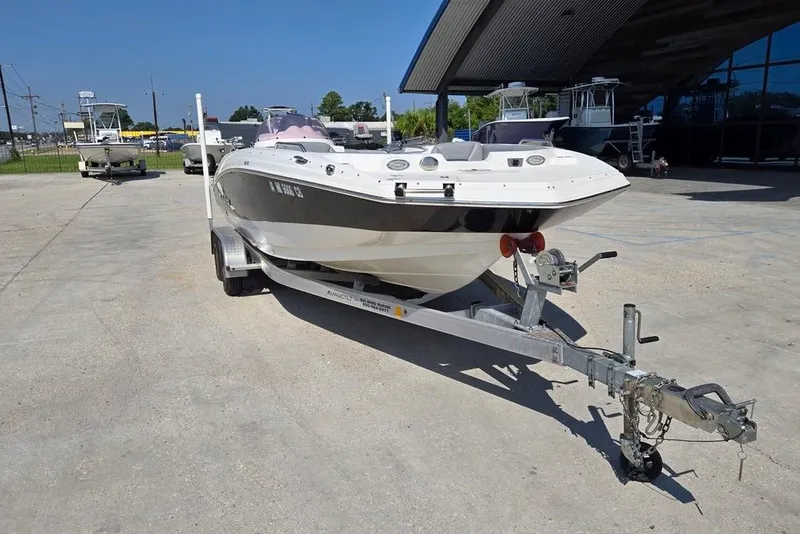 Slide: The Image of 2021 NauticStar 203 SE boat with spacious seating and modern design. - 8