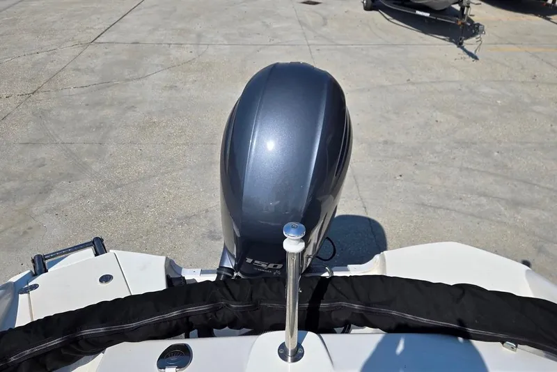 Slide: The Image of 2021 NauticStar 203 SE boat interior with gray seating and storage compartments. - 9