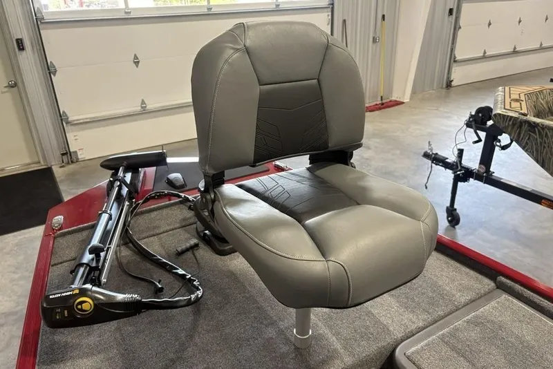 Slide: The Image of 2026 Tracker Bass Tracker Classic XL boat seat in a garage setting. - 11