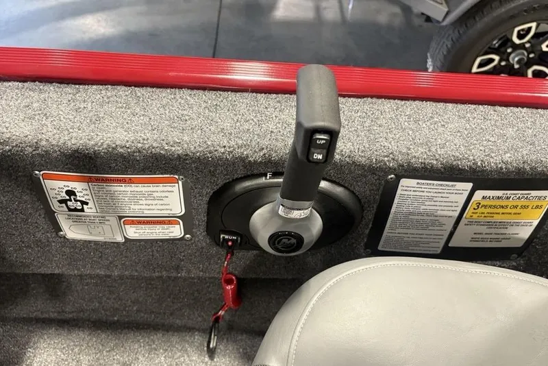 Slide: The Image of Control panel of 2026 Tracker Bass Tracker Classic XL boat with warning labels. - 19