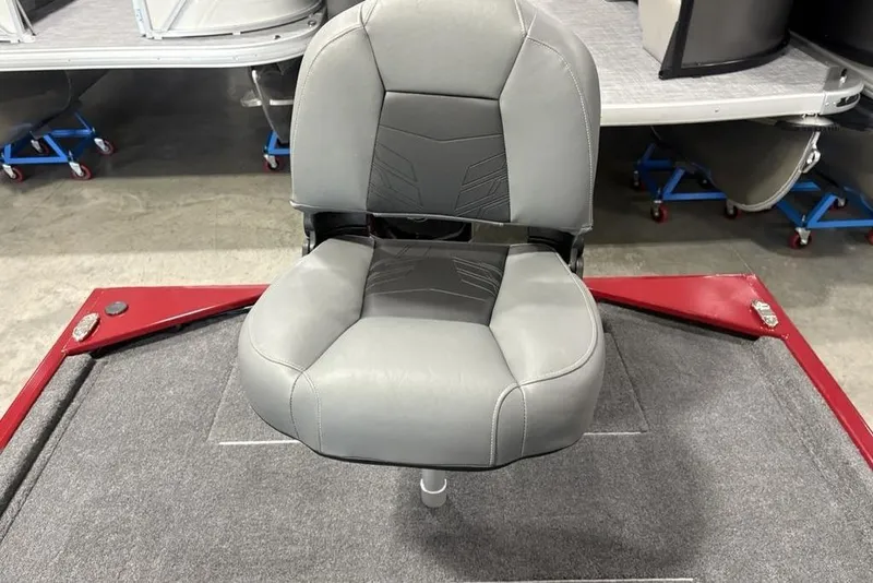 Slide: The Image of 2026 Tracker Bass Tracker Classic XL boat seat, gray upholstery, on red and gray deck. - 20