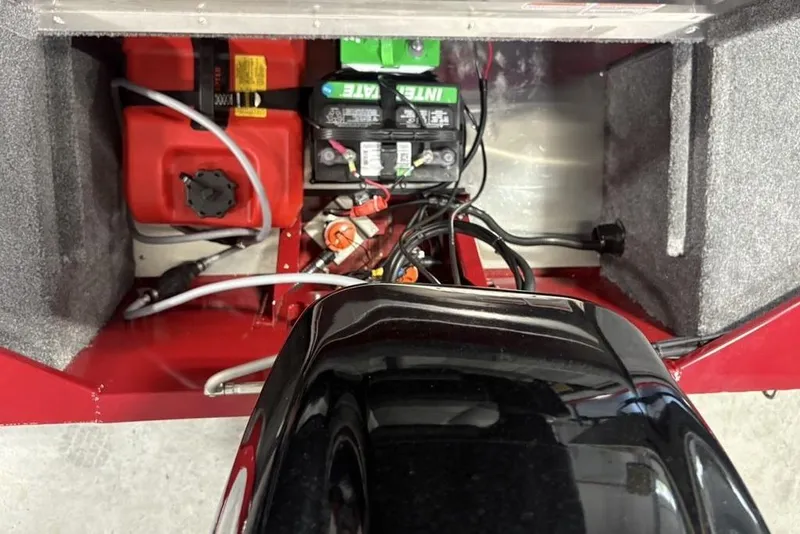Slide: The Image of Interior view of a 2026 Tracker Bass Tracker Classic XL boat showing battery and fuel tank setup. - 22