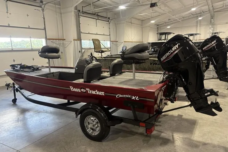 Slide: The Image of 2026 Tracker Bass Tracker Classic XL boat with Mercury engine in showroom. - 4