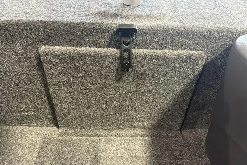 Slide: The Image of 2026 Tracker Bass Tracker Classic XL interior with carpeted storage compartment. - 7