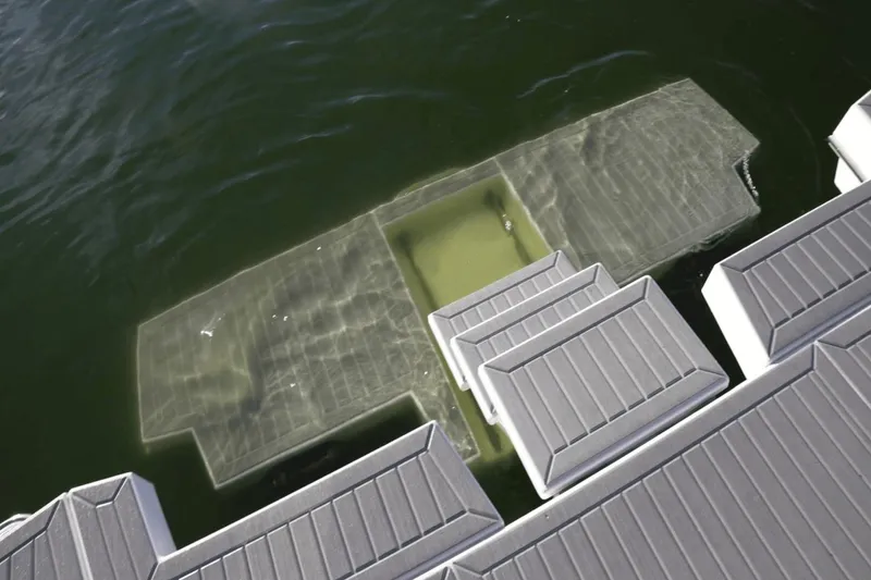 Slide: The Image of Underwater view of a submerged 2022 Cruisers 42 GLS boat near a dock. - 12