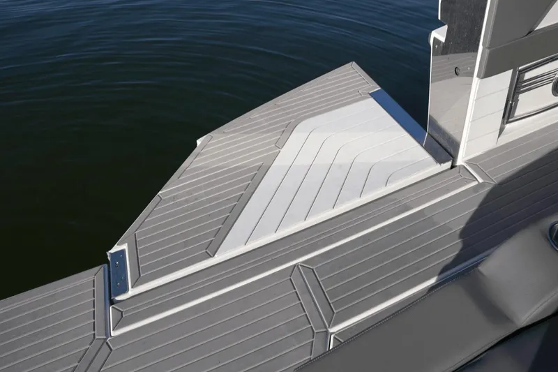 Slide: The Image of 2022 Cruisers 42 GLS boat deck with sleek, modern design and water backdrop. - 13