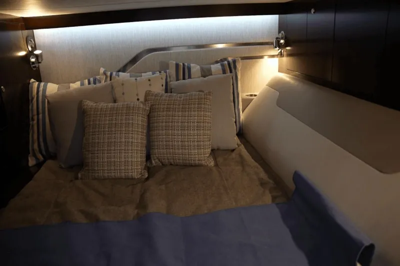 Slide: The Image of Luxurious cabin interior of 2022 Cruisers 42 GLS yacht with cozy bedding. - 31
