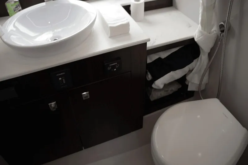 Slide: The Image of Luxurious bathroom in 2022 Cruisers 42 GLS yacht with modern sink and toilet. - 32
