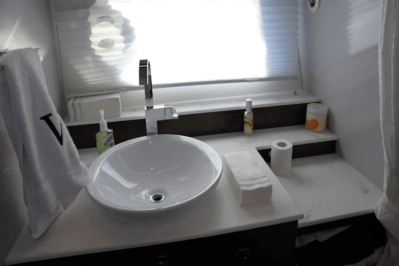 Slide: The Image of Modern bathroom sink area in 2022 Cruisers 42 GLS yacht, featuring sleek fixtures and accessories. - 33