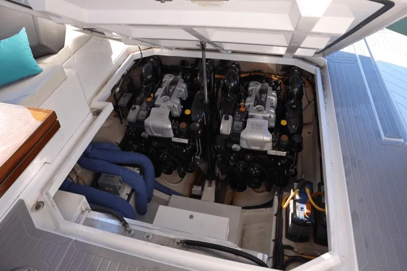 Slide: The Image of Engine compartment of 2022 Cruisers 42 GLS boat, showcasing dual engines and components. - 35