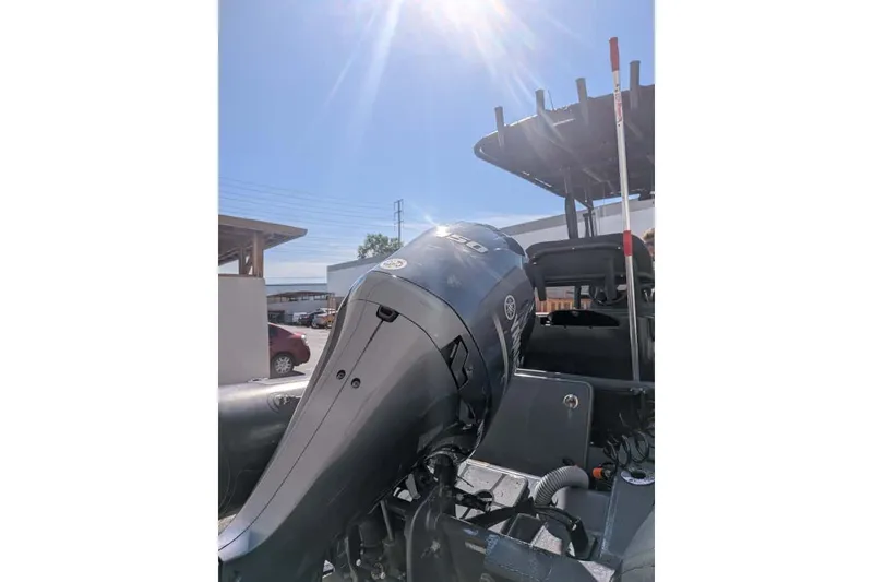 Slide: The Image of 2022 Zodiac 20 boat with powerful outboard motor under bright sunlight. - 19