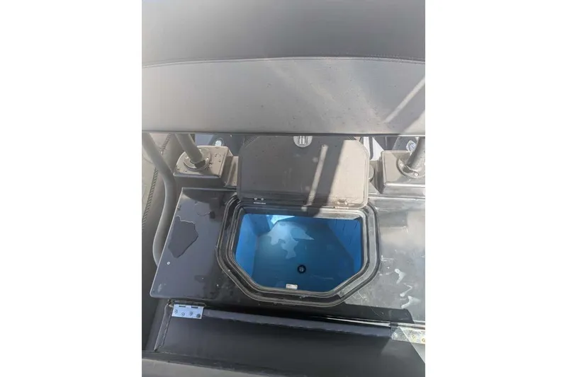 Slide: The Image of Open storage compartment on Zodiac 20 boat, 2022 model, with blue interior. - 23