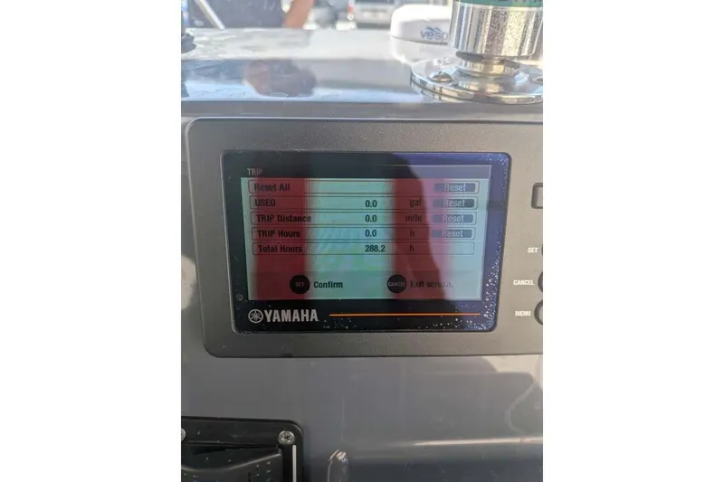 Slide: The Image of Yamaha display on Zodiac 20 boat, showing trip data and total hours. - 7